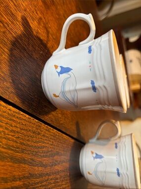 White Ceramic Goose Mug with Blue and Orange Accents